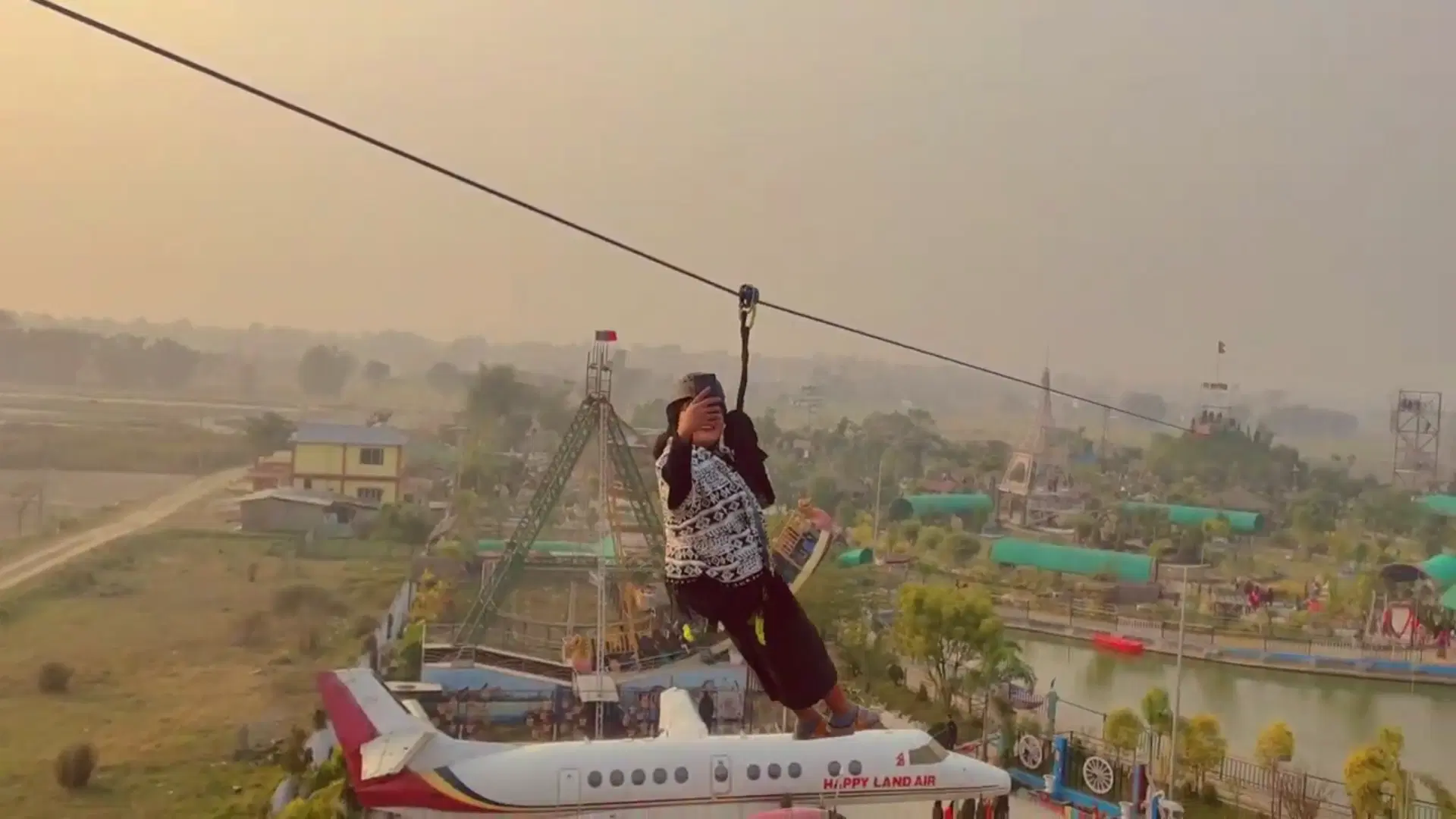 Dual-way zipline on steel towers at Happyland Adventure Park, Jhapa, Nepal