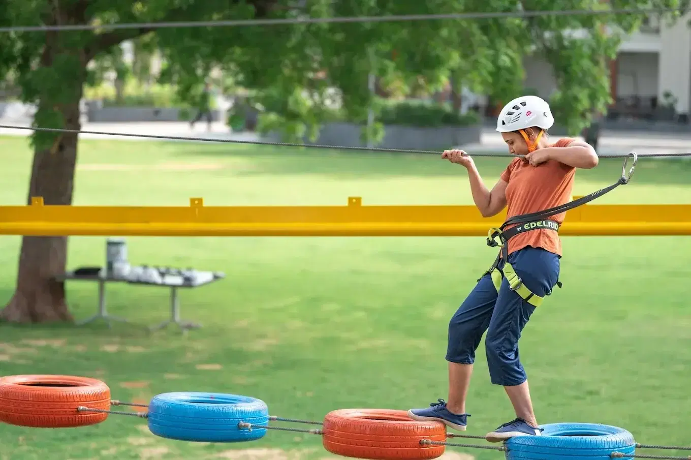 Child on the balance obstacle with tyres at Roadies Rostel