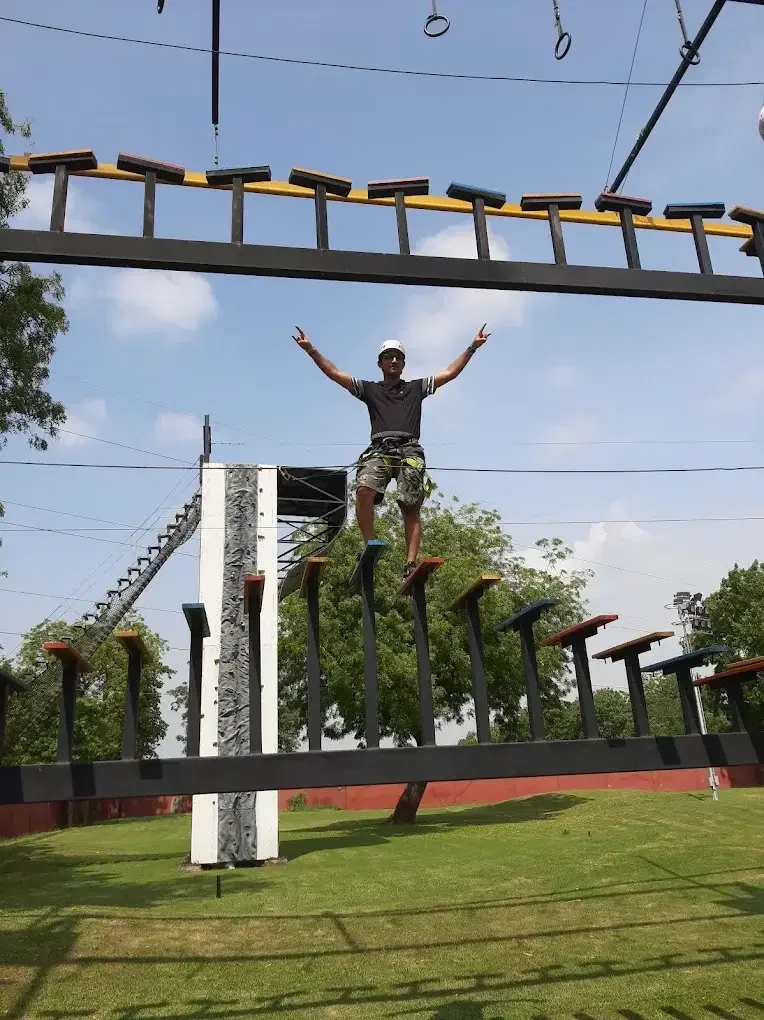 Rider at the summit of the ropes course at Roadies Rostel