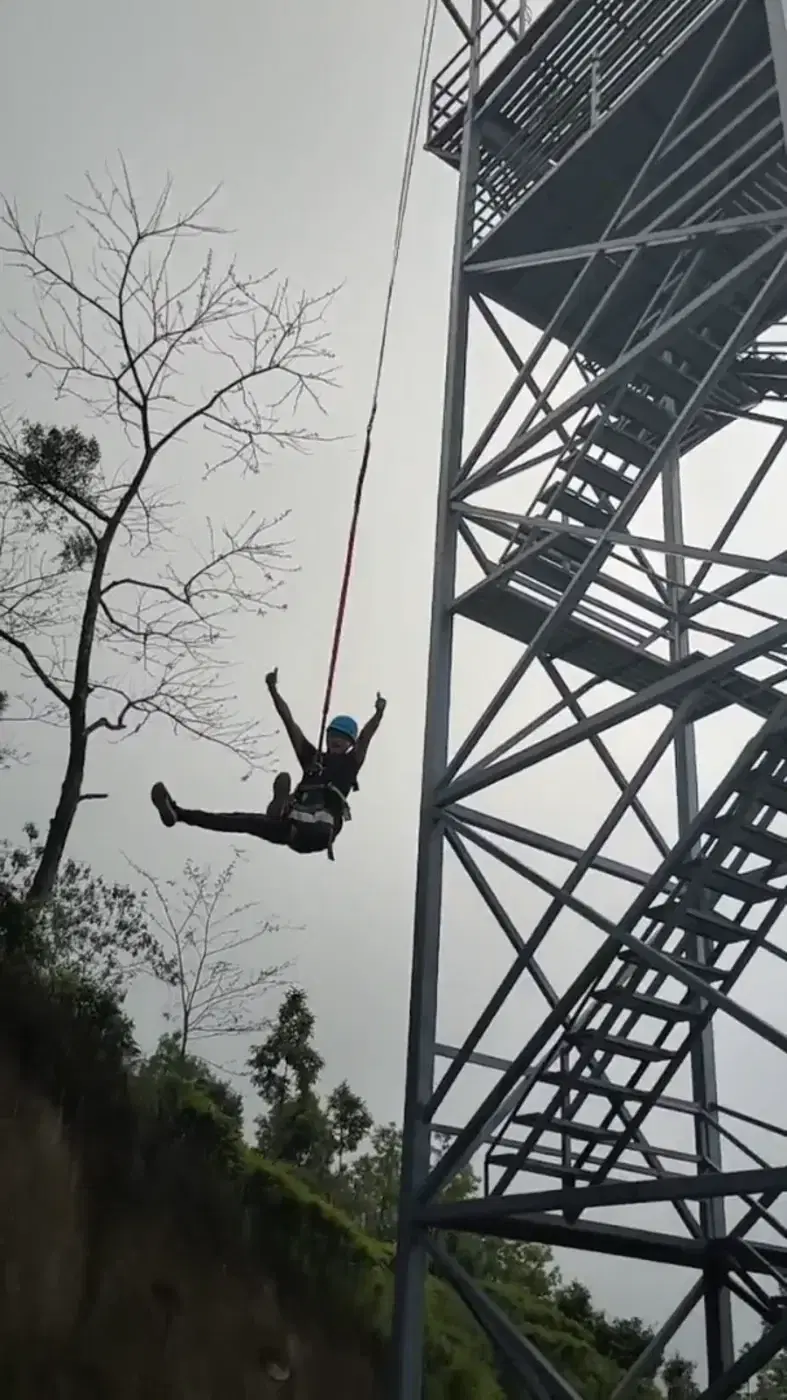Rider in free fall on the quick jump at Ilam