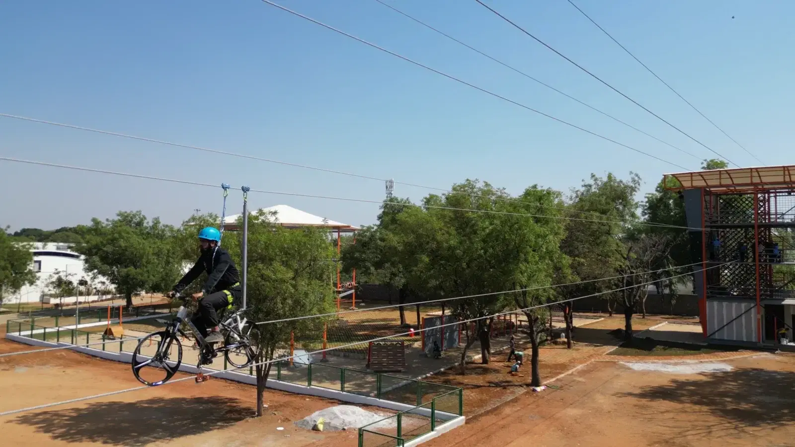 Students riding the sky cycle on the Sreenidhi campus