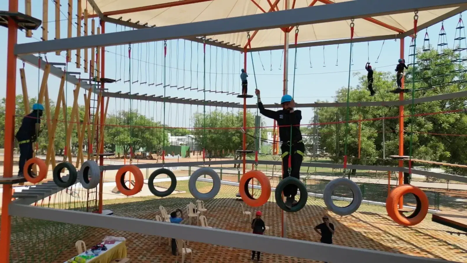 Students crossing tyre elements with auto-belay protection at Sreenidhi