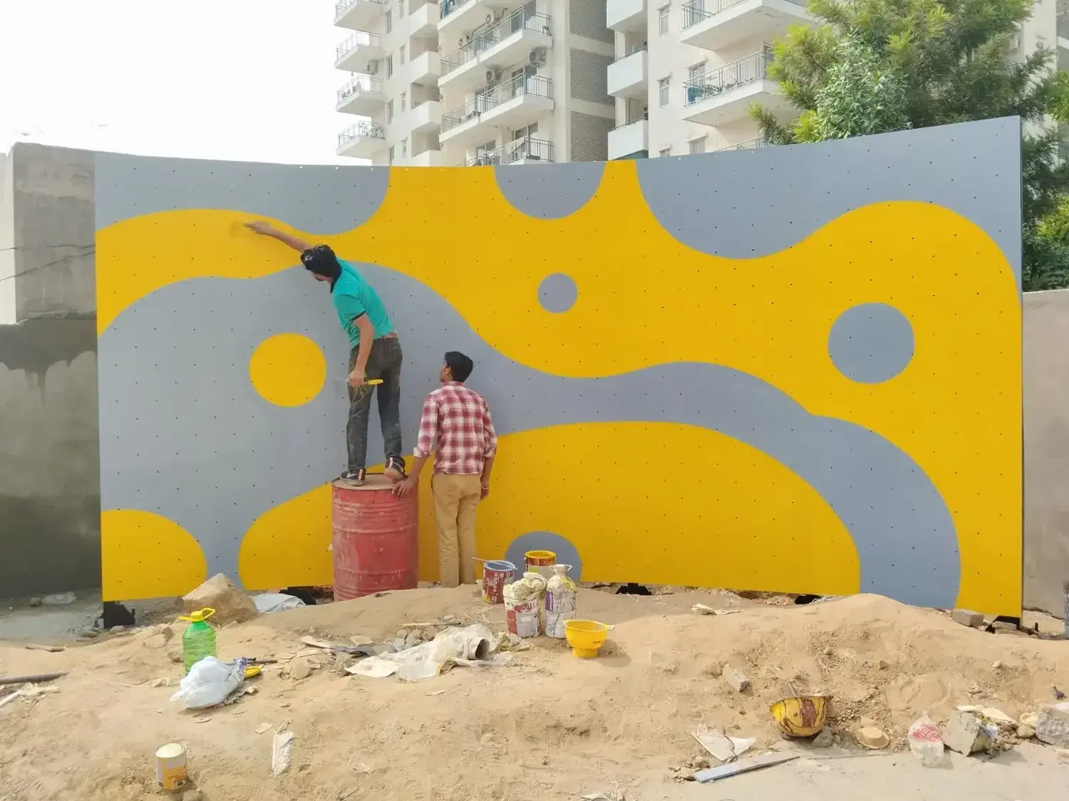 Finishing work on the Mapsko residents bouldering wall