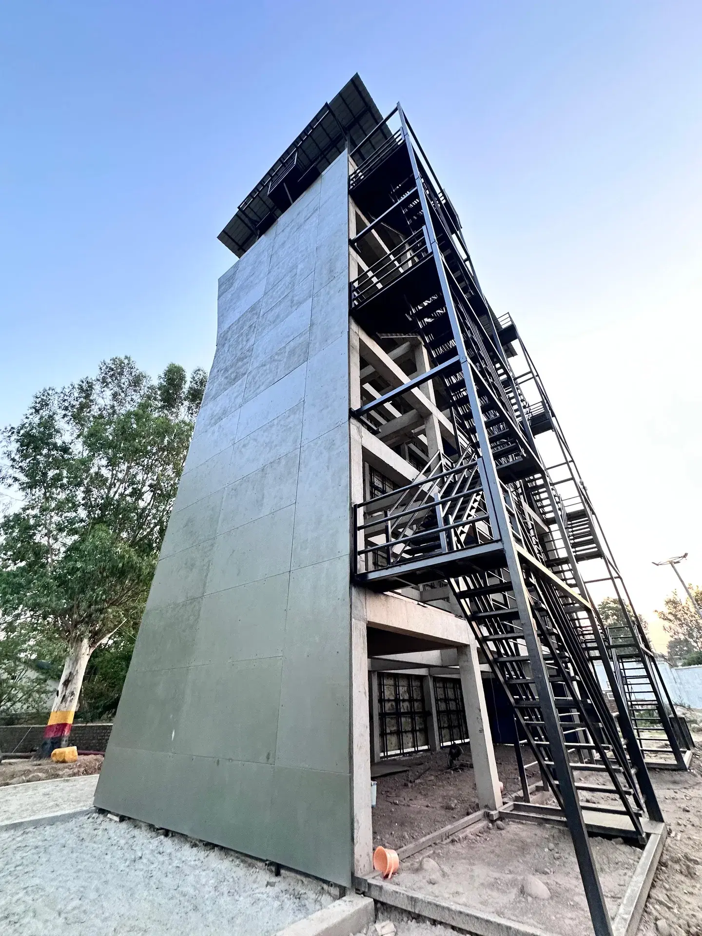 OXO Planet structural steel tower behind the 18 m x 16 m single-face climbing wall at 9 Para, Udhampur