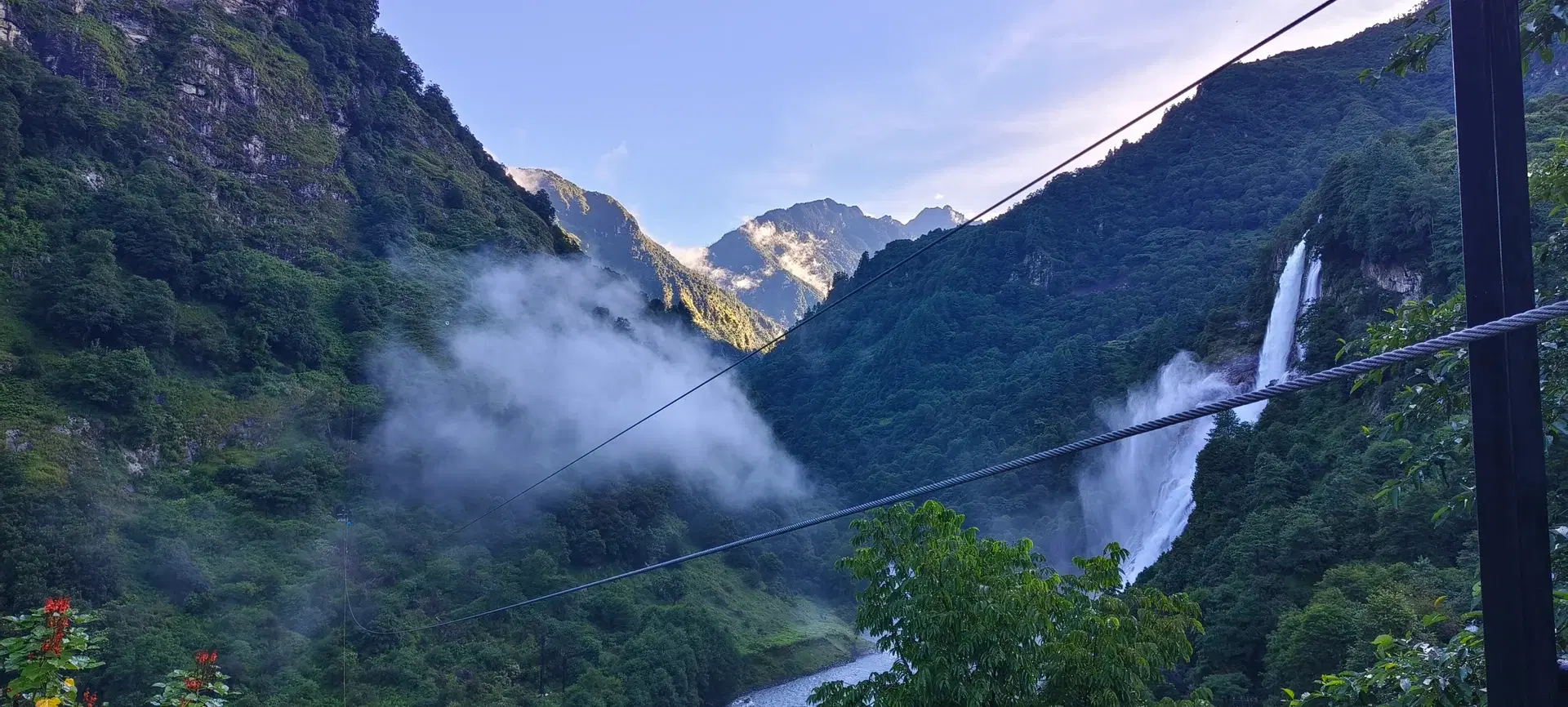 OXO Planet zipline cable crossing the gorge above the waterfall at Fong Fong Ma (Jang Falls), Tawang, Arunachal Pradesh