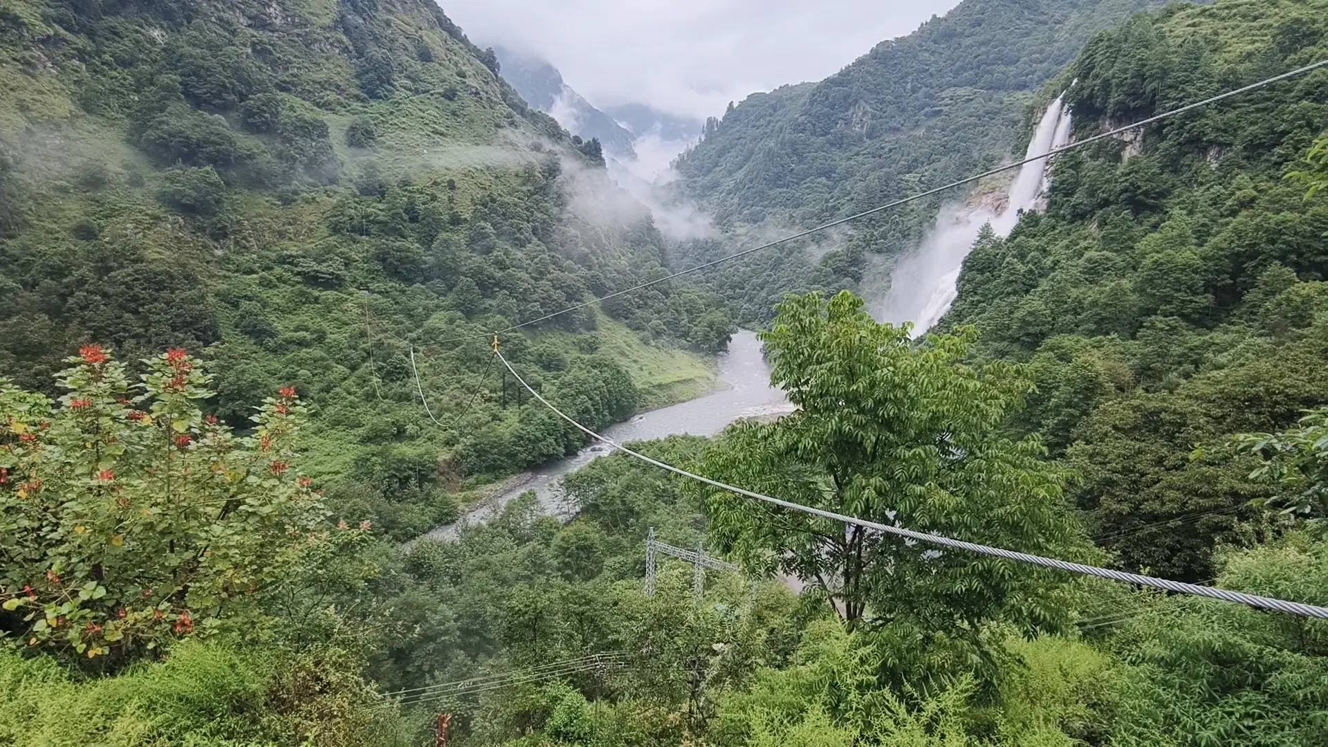 OXO Planet zipline cables crossing the gorge past the waterfall at Fong Fong Ma (Jang Falls), Tawang, Arunachal Pradesh