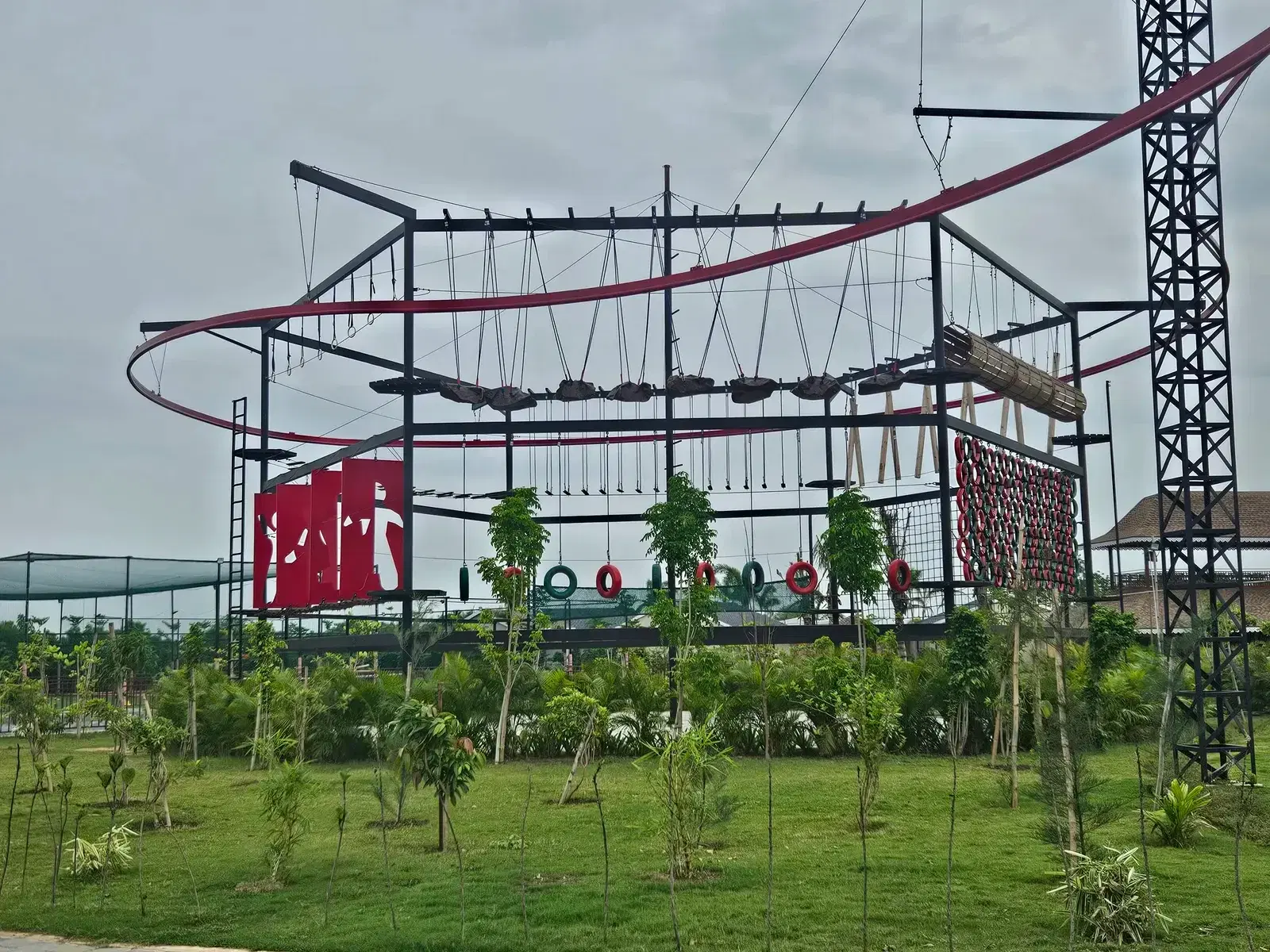 Multi-floor ropes course beneath the roller coaster zipline track at Maira Resort