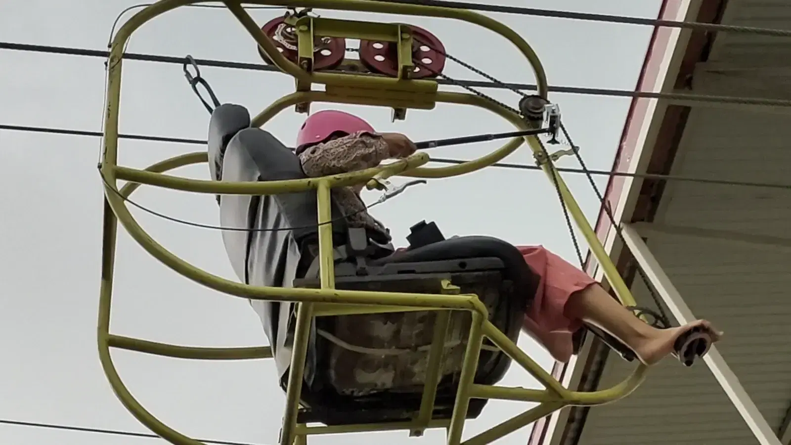 Rider on the caged sky cycle at YOYO Adventure Park, Kathmandu