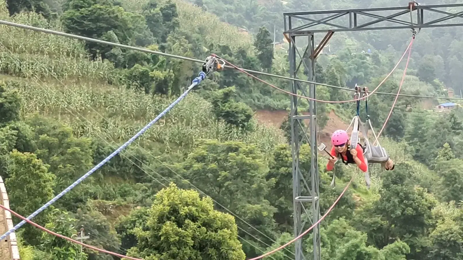 Zipline arrival tower with riders at YOYO Adventure Park, Kathmandu