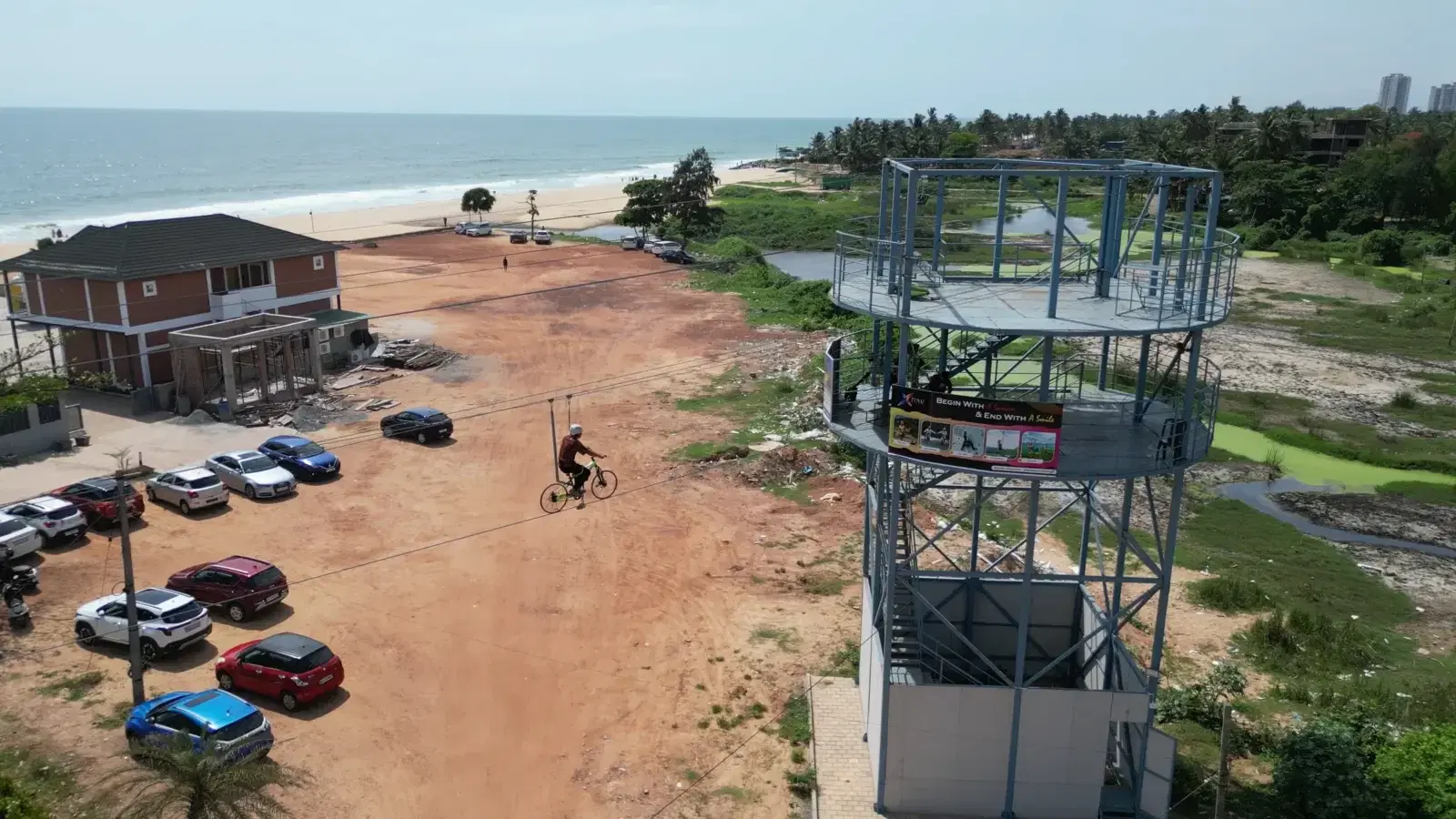 Zipline rider launching over the sand from the Teammanthras tower
