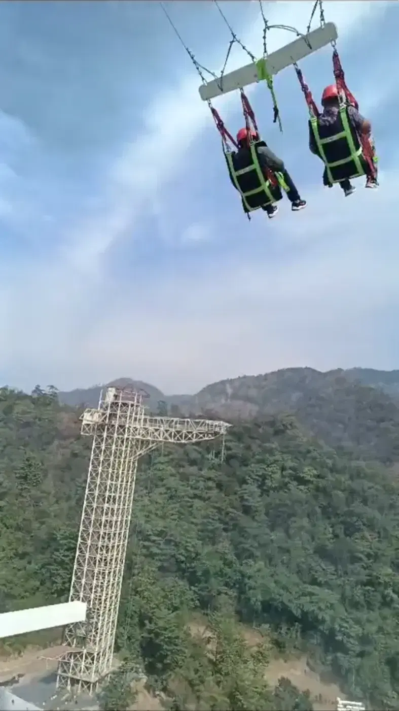 Riders on the world’s first giant swing mounted on a bungee tower, D Splash Rishikesh