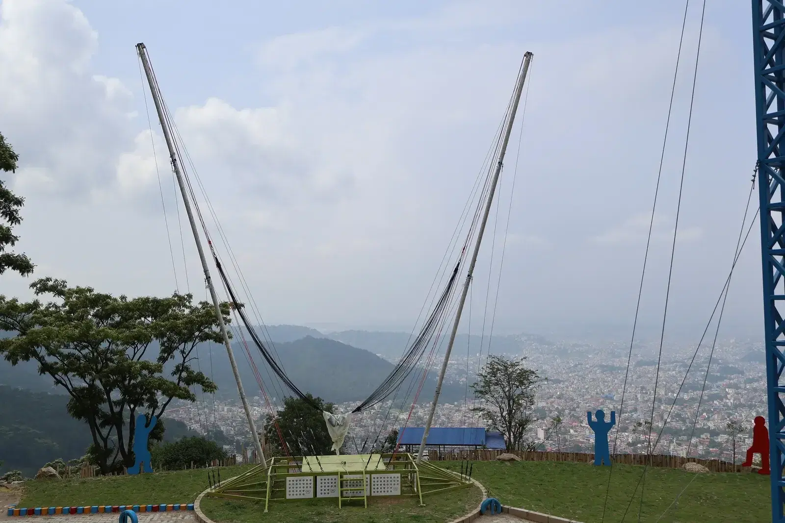 Riders on the human gyro at the Choudhary Group adventure park