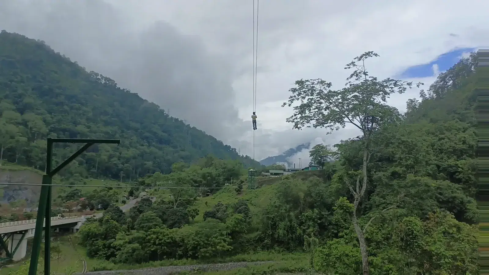 Zipline line stretching over the misty Siang valley at Pasighat
