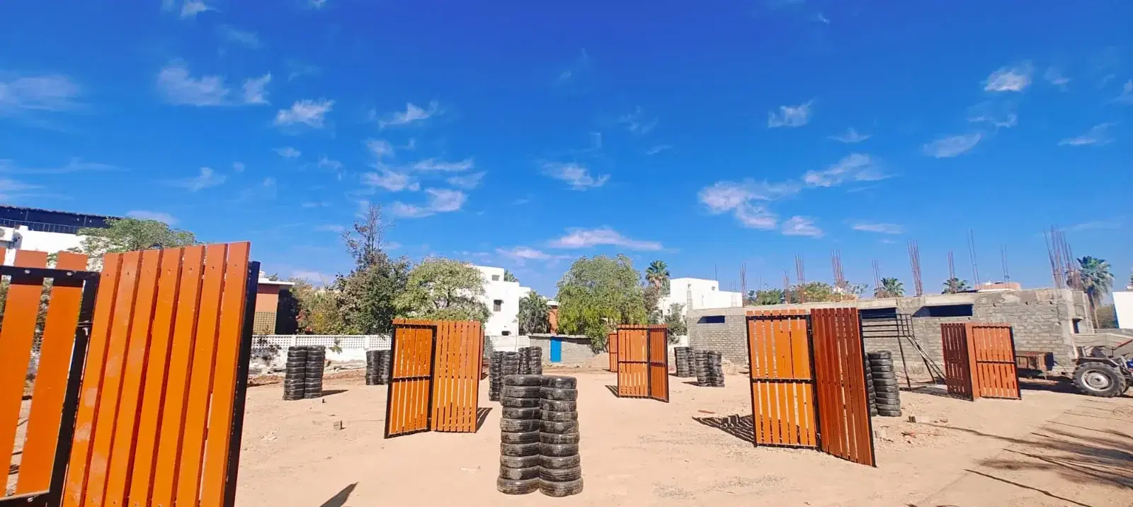 Outdoor laser tag arena with barricades at Adani Mundra