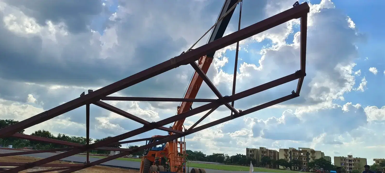 Crane lifting a frame section of the ITBP climbing wall structure