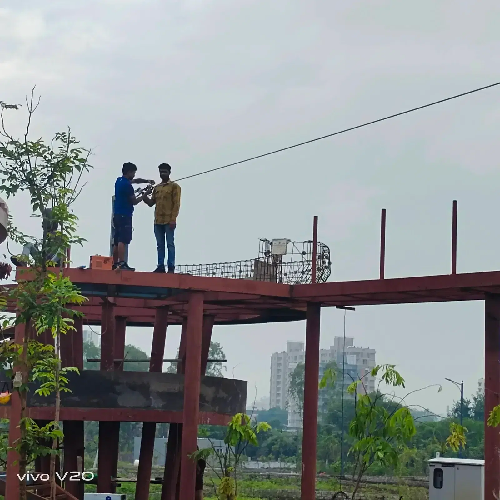 Crew installing the zipline cable at Godrej Skyline, Pune