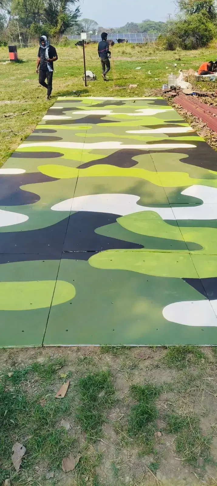 Camouflage climbing panels being custom painted for the Barrackpore wall