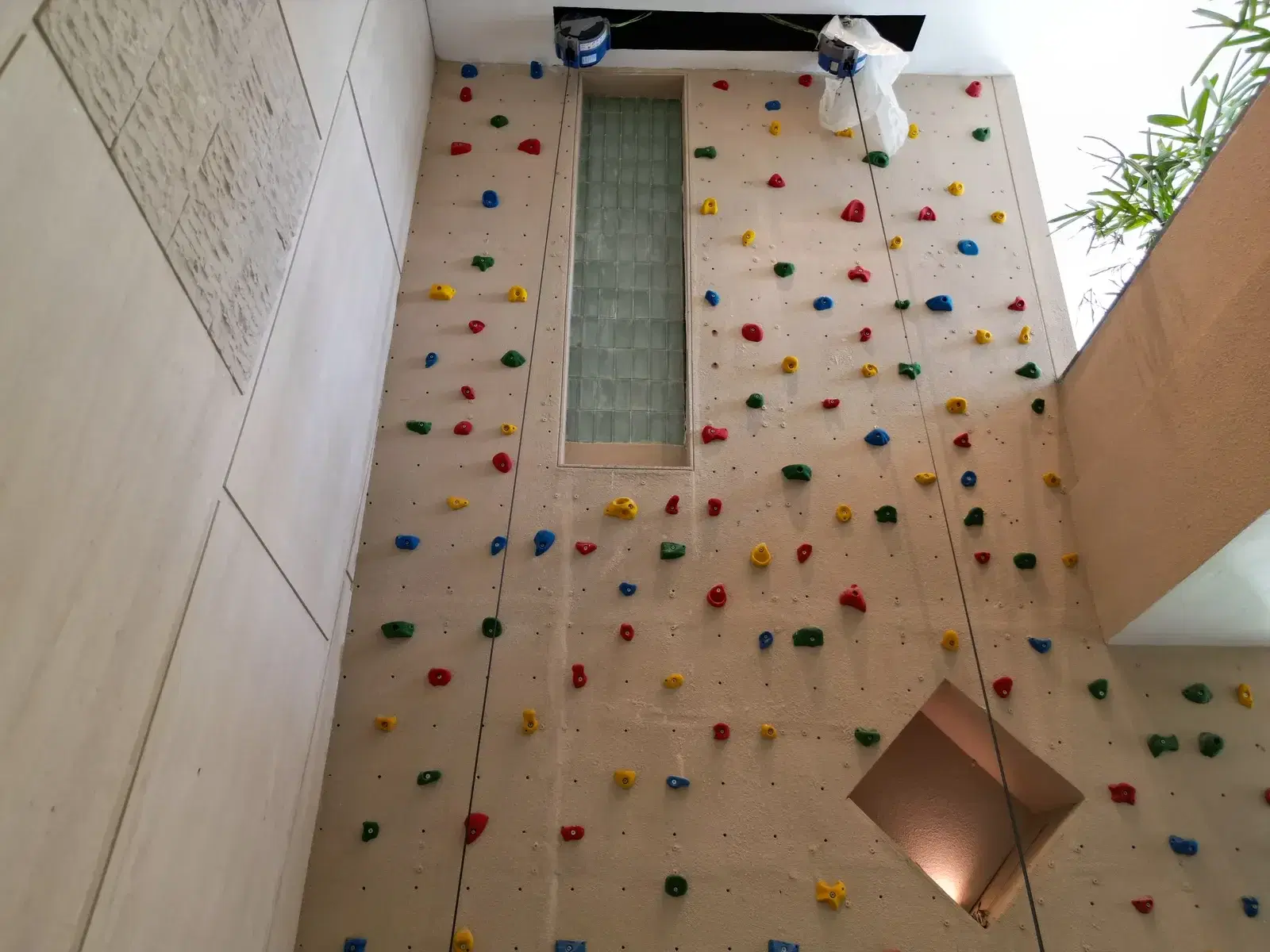 Looking up the full-height designer climbing wall at the Hailey Road residence