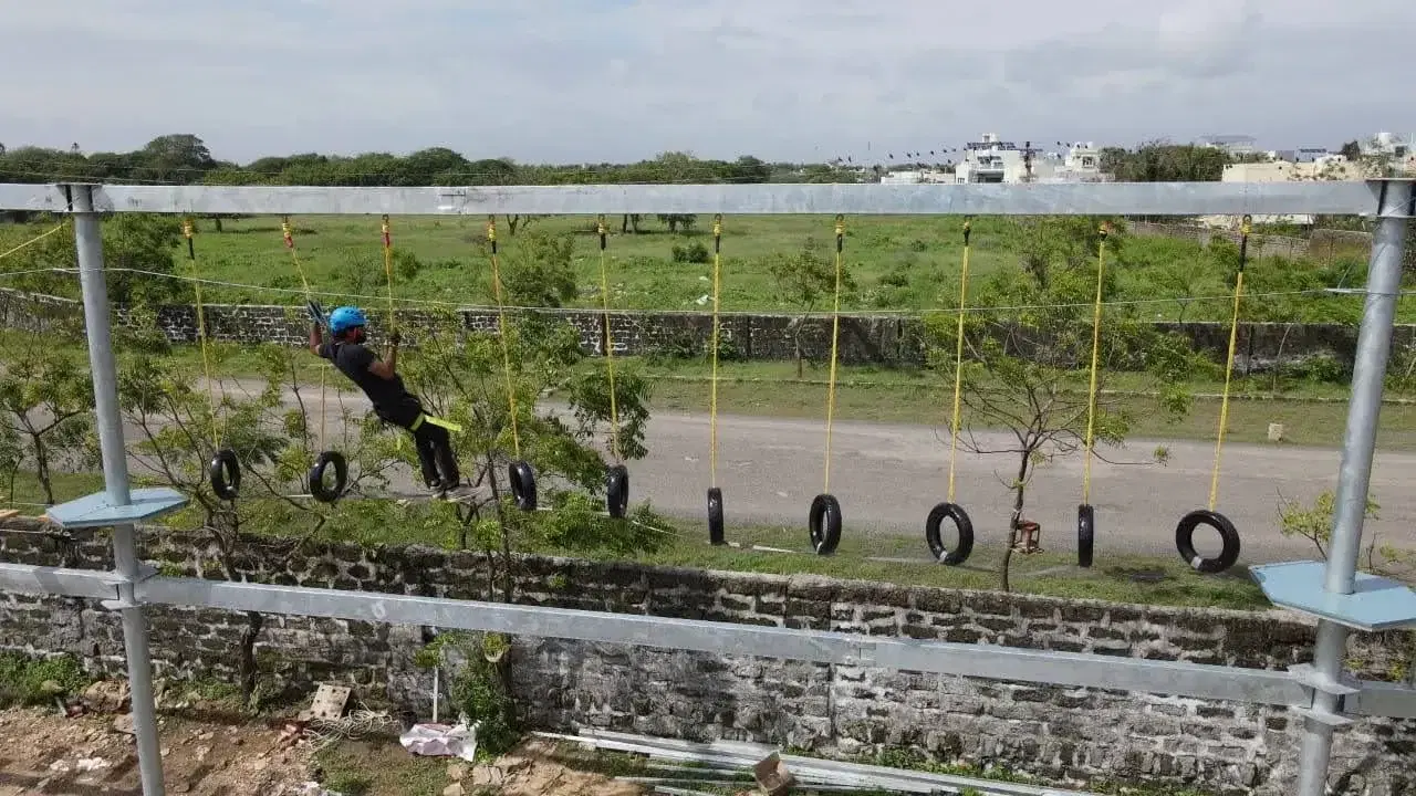 Tyre traverse element on the Mehta Group school ropes course