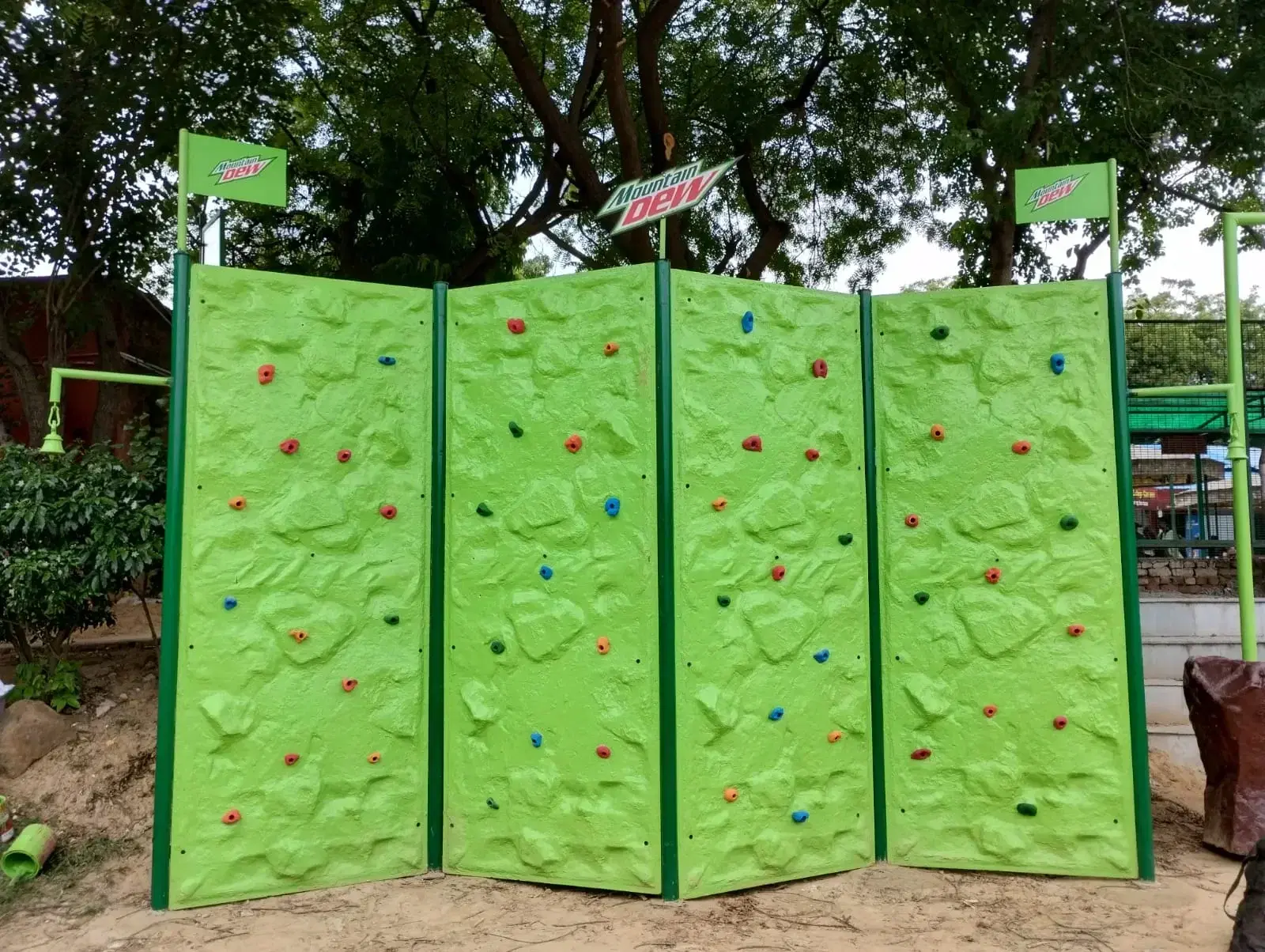 Mountain Dew branded traverse climbing wall at a college activation