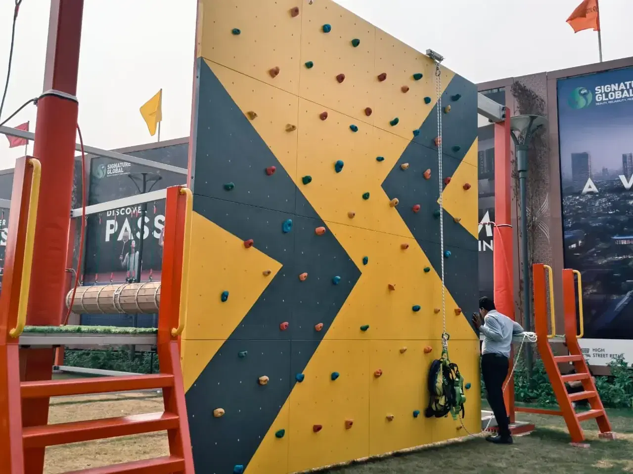 Climber on the chevron climbing wall at Signature Global