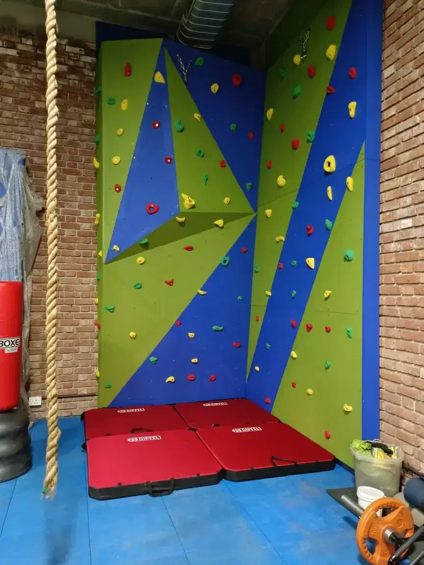 Geometric advanced bouldering face at the DLF Farms home wall, Delhi
