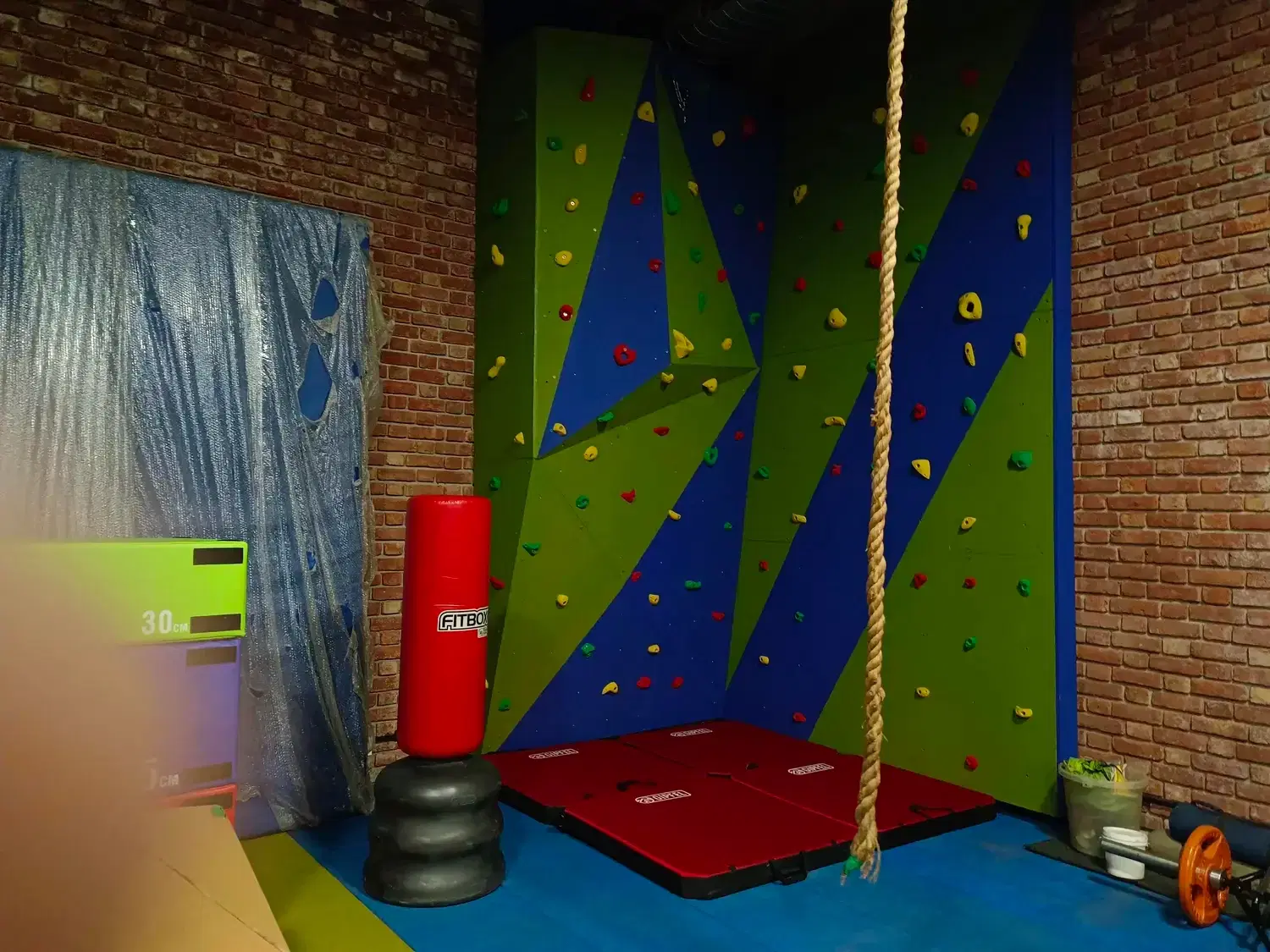 Both faces of the two-face bouldering wall in the DLF Farms home gym