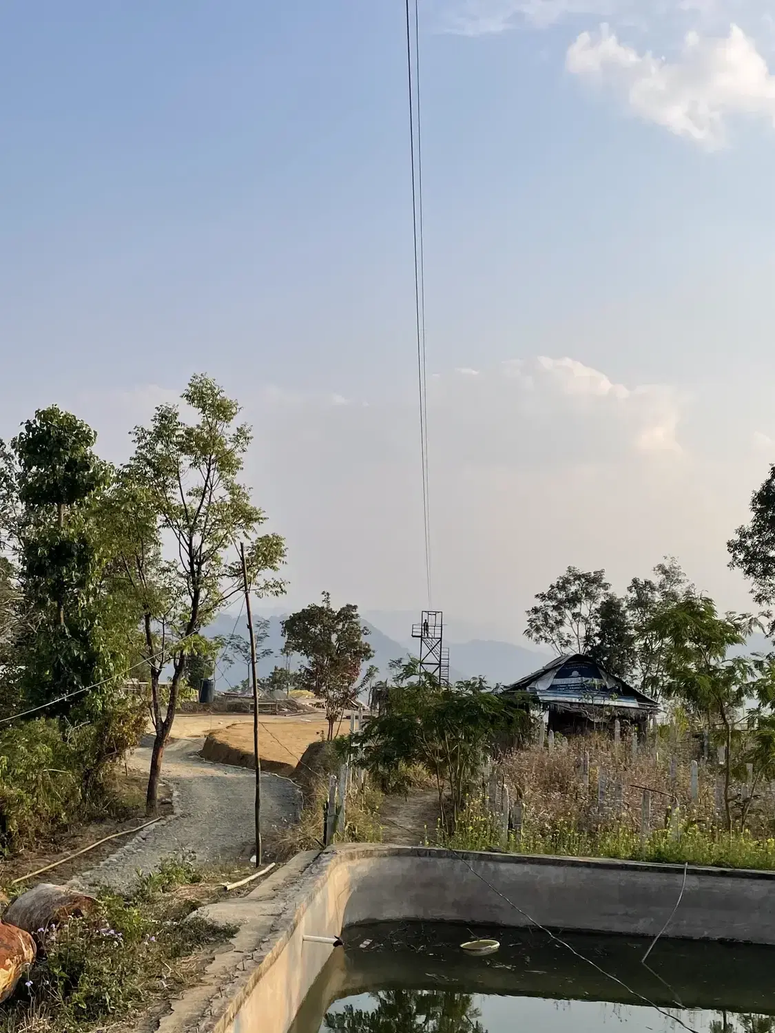 Zipline cable running over the valley at Lungleng, Mizoram