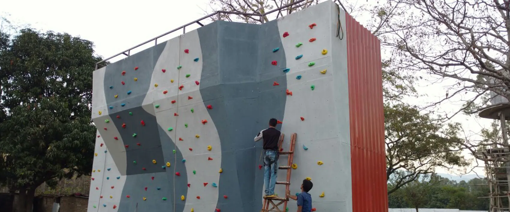 team working on manufacturing a clilmbing wall in India