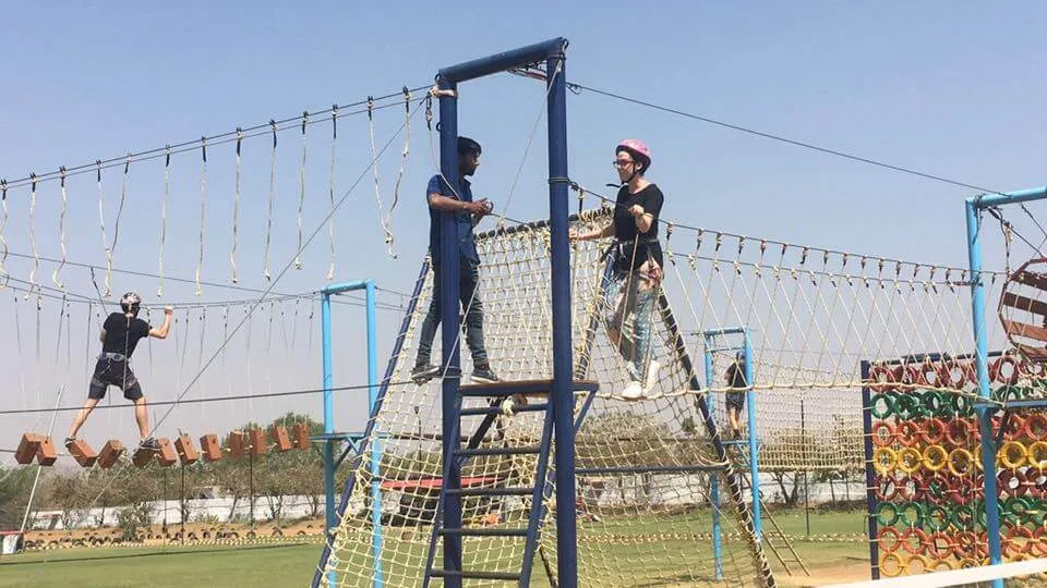 Kids enjoying obstacle course activity in an adventure park designed by oxo