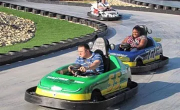 kids racing on a go karting setup in a school